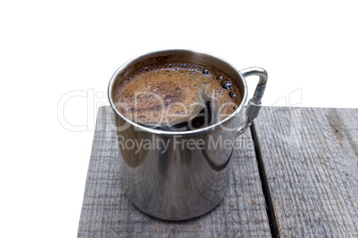 Metal mug of coffee