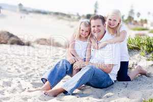 Handsome Dad and His Cute Daughters at The Beach