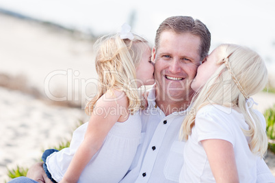 Handsome Dad Getting Kisses from His Cute Daughters