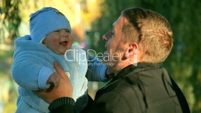 father and baby laugh