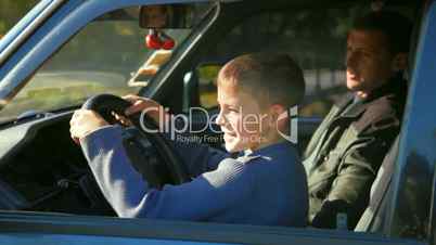 father and son in the car