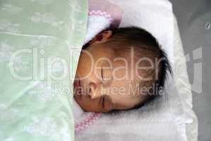 Newborn Baby Girl in her Bed, Italy