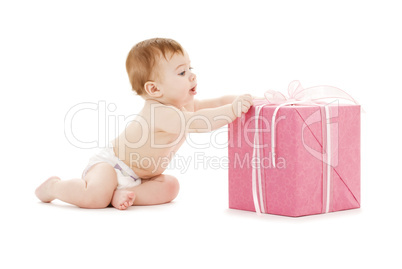 baby boy with big gift box