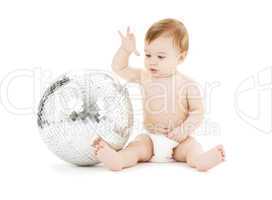 adorable baby boy with big disco ball