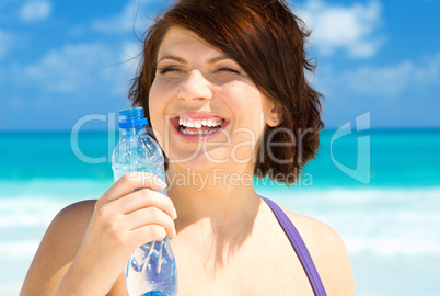 happy woman with bottle of water