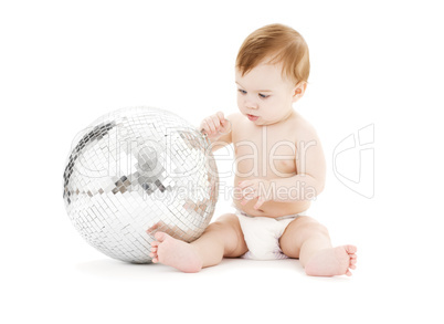 adorable baby boy with big disco ball