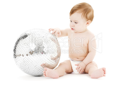 adorable baby boy with big disco ball