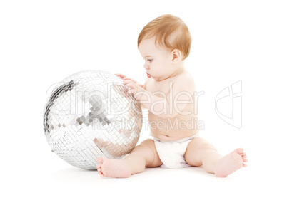 adorable baby boy with big disco ball