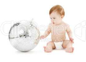 adorable baby boy with big disco ball