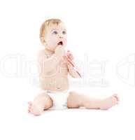 baby boy in diaper with toothbrush