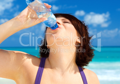 happy woman with bottle of water