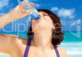 happy woman with bottle of water