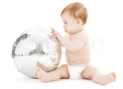 adorable baby boy with big disco ball