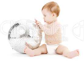 adorable baby boy with big disco ball