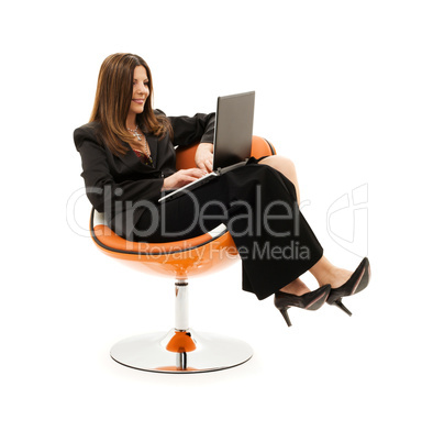 businesswoman in chair with laptop