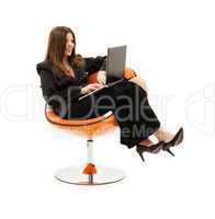 businesswoman in chair with laptop