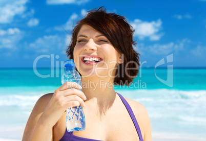 happy woman with bottle of water