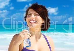 happy woman with bottle of water