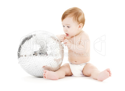 adorable baby boy with big disco ball