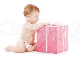 Baby boy with pink gift