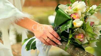 bride's hand with a bouquet