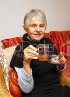 Senior with Cup of Tea - Seniorin beim Tee trinken