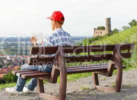 Senior reading Book outdoors - Relax Concept