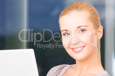 happy businesswoman with laptop computer