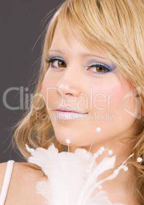 teenage girl with feather