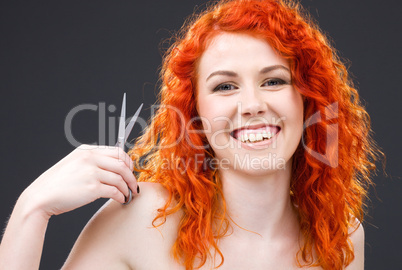 redhead with scissors