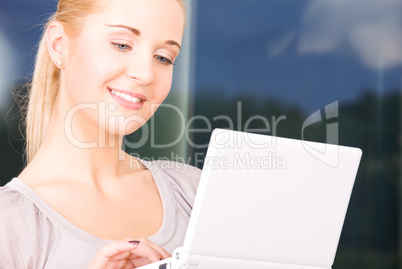 happy businesswoman with laptop computer