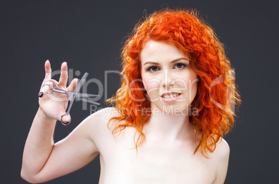 redhead with scissors