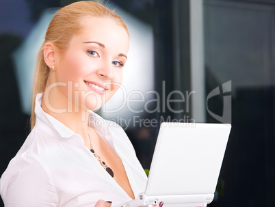 happy businesswoman with laptop computer