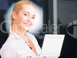 happy businesswoman with laptop computer