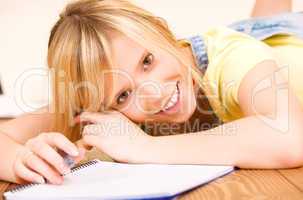 teenage girl with notebook and pen