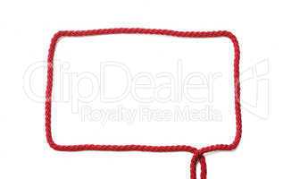 Rectangular frame of red cord with ends