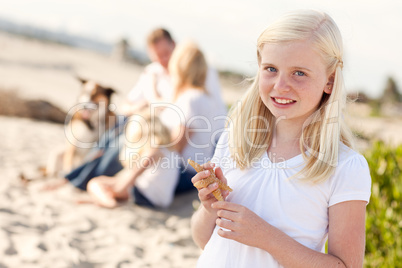 Adorable Little Blonde Girl with Starfish