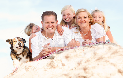 Happy Caucasian Family and Dog Portrait at the Beach