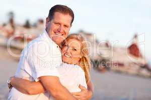 Attractive Caucasian Couple Hugging at the Beach