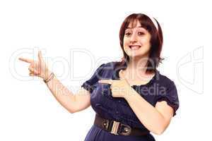 Happy Young Caucasian Woman Pointing to the Side on White