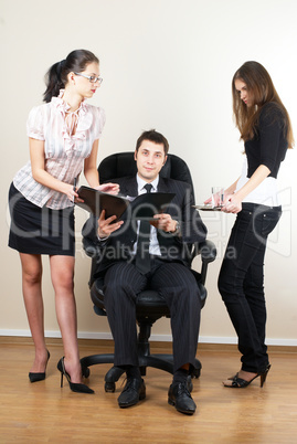 Businessman with assistants