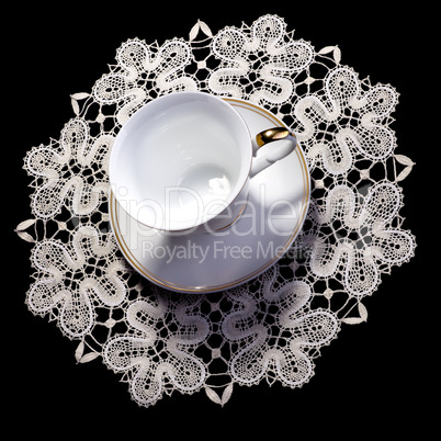 small lacy doily with  cup