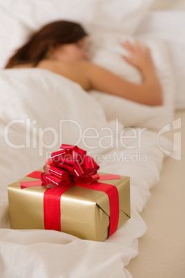 Surprise present - young woman sleeping