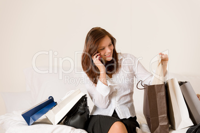 Woman on phone - back home from shopping
