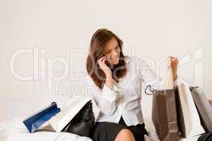 Woman on phone - back home from shopping