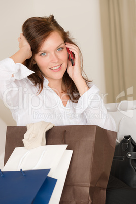 Woman on phone - back home from shopping