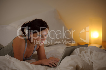 Bedroom evening - woman with laptop