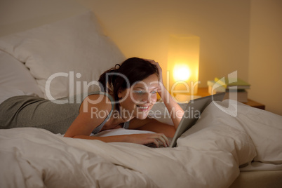 Bedroom evening - woman with laptop