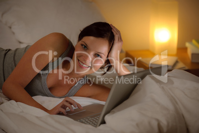 Bedroom evening - woman with laptop