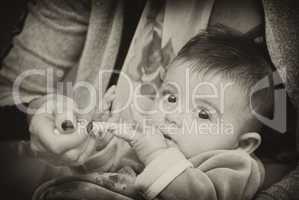 Baby Girl eating with her Mother